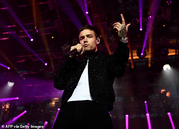 (FILES) Britain singer Liam Payne performs on stage during a concert in front of the Hotel de Ville in Paris on September 15, 2017 to celebrate Paris' coronation as host of the 2024 Olympics Games. Liam Payne, who died aged 31 after plunging from a hotel balcony in Buenos Aires, on October 16, 2024 spent more than half his life in the public eye as a member of one of the world's most successful boy bands. (Photo by CHRISTOPHE SIMON / AFP) (Photo by CHRISTOPHE SIMON/AFP via Getty Images)