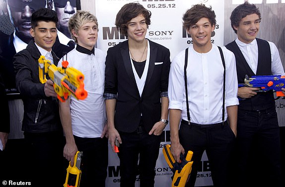 FILE PHOTO: Members of British-Irish boy band One Direction (L-R) Zayn Malik, Niall Horan, Harry Styles, Louis Tomlinson and Liam Payne arrive for the premiere of "Men In Black 3" in New York, U.S., May 23, 2012.  REUTERS/Andrew Kelly/File Photo