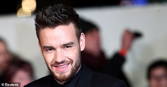 FILE PHOTO: Singer Liam Payne poses for photographers at the world premiere of the film "I am Bolt" in London, Britain, November 28, 2016. REUTERS/Neil Hall/File Photo