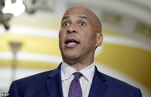 Sen. Cory Booker, D-N.J., talks after a policy luncheon on Capitol Hill Tuesday, Dec. 3, 2024, in Washington. (AP Photo/Mariam Zuhaib)