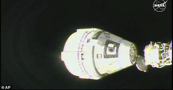 In this image from video provided by NASA, the unmanned Boeing Starliner capsule undocks as it pulls away from the International Space Station on Friday, Sept. 6, 2024. (NASA via AP)