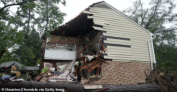 SPRING, TEXAS - JULY 8: The damage at a home in the 17400 block of Rustic Canyon Trail is shown where Maria Loredo, 74, died after a tree fell on her second story bedroom during Hurricane Beryl Monday, July 8, 2024, in Houston. (Melissa Phillip/Houston Chronicle via Getty Images)